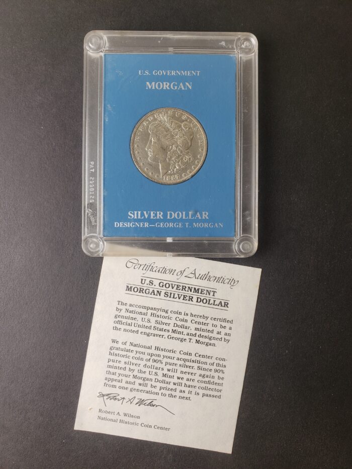 1887 O $1 Morgan Silver Dollar in a Plastic Holder