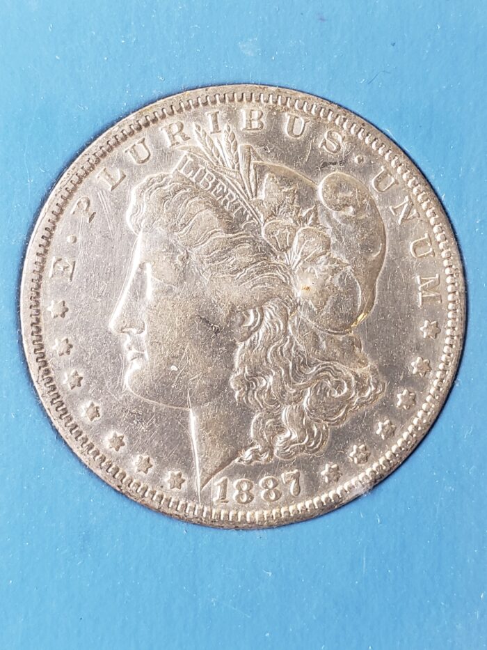 1887 O $1 Morgan Silver Dollar in a Plastic Holder - Image 2