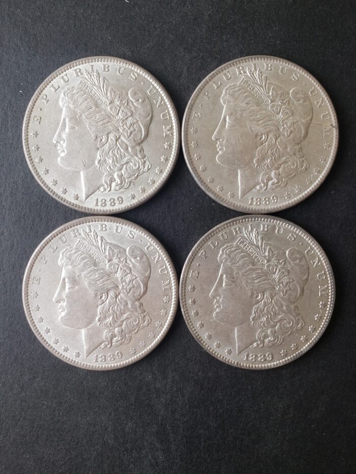 Lot of Four 1889 $1 Morgan Silver Dollars