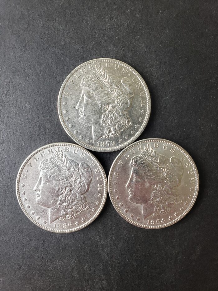 1879 O, 1886, and 1904 O $1 Morgan Silver Dollars