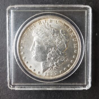 1887 $1 Morgan Silver Dollar in a Plastic Holder